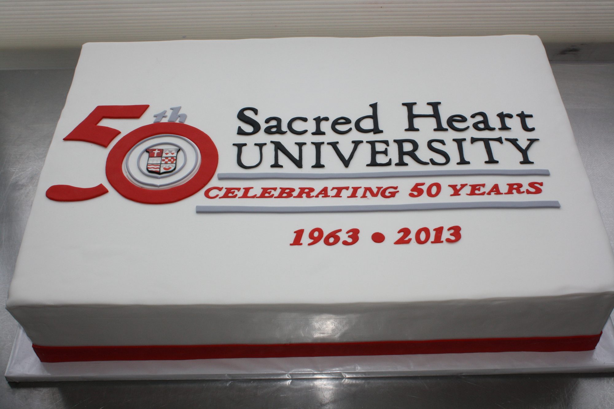 University 50th anniversary sheet cake